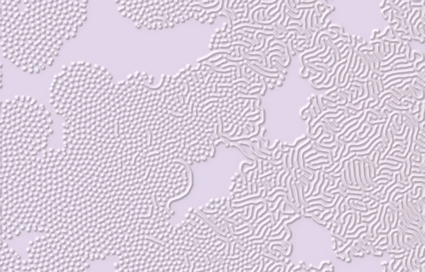 Embossed lilac tissue with cellular and labyrinthine relief patterns